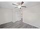 Bright bedroom featuring a closet, neutral paint and wood-look floors at 3248 Sw 149Th Pl, Ocala, FL 34481