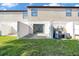 Cozy back patio with sliding glass door and green grassy yard at 329 Marion Oaks Blvd # A3, Ocala, FL 34473