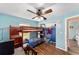 Bedroom with bunk beds, ceiling fan, a closet, and hardwood-style floors at 3428 Ne 17Th Ter, Ocala, FL 34479