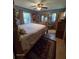 Bedroom featuring a bed, dresser, and natural light offers a comfortable and inviting space for relaxation and rest at 3709 Ne 4Th St, Ocala, FL 34470