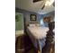 Bedroom featuring a four-poster bed, creating a cozy and inviting space for relaxation and rest at 3709 Ne 4Th St, Ocala, FL 34470