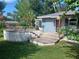 Wooden deck in a landscaped backyard, perfect for outdoor lounging and entertaining at 3709 Ne 4Th St, Ocala, FL 34470