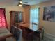 Bright dining room with a wood table, hutch, and large window, perfect for enjoying meals and natural light at 3709 Ne 4Th St, Ocala, FL 34470