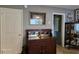 Charming living room featuring classic furniture, neutral wall colors, and a decorative display cabinet at 3709 Ne 4Th St, Ocala, FL 34470
