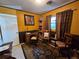 Functional office space with a classic desk, warm colors, and decorative accents at 3709 Ne 4Th St, Ocala, FL 34470