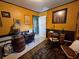 Inviting home office featuring warm colors, antique decor, and ample space for creativity and work at 3709 Ne 4Th St, Ocala, FL 34470