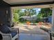 Charming brick patio featuring outdoor seating, a fire pit, and landscaped backyard at 3709 Ne 4Th St, Ocala, FL 34470