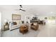 Bright, open-concept living space with a ceiling fan, views into the kitchen, and modern décor at 391 Nw Crocus Ln, Dunnellon, FL 34431