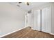 Bedroom with hardwood floors and closet doors, creating a cozy and organized space at 4250 Nw 26Th Ter, Ocala, FL 34475