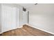 Well-lit bedroom features wood-look flooring and a large closet, enhancing its appeal at 4250 Nw 26Th Ter, Ocala, FL 34475