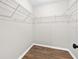 Walk-in closet provides ample storage space with white wire shelving system at 4250 Nw 26Th Ter, Ocala, FL 34475