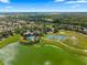 Wide aerial shot showcasing community with pool, playground, tennis/basketball courts, and surrounding neighborhood at 4429 Sw 49Th Ave, Ocala, FL 34474