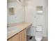 Bathroom featuring neutral-tone countertops, vanity, mirror and toilet at 4429 Sw 49Th Ave, Ocala, FL 34474