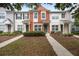 Charming townhome with a colorful facade, well-maintained landscaping, and inviting entryway at 4429 Sw 49Th Ave, Ocala, FL 34474