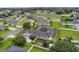 Aerial shot featuring a backyard with a screened pool and a spacious green lawn at 4731 Se 34Th St, Ocala, FL 34480