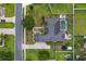 Aerial view showcases a backyard with a screened pool and lush green landscaping at 4731 Se 34Th St, Ocala, FL 34480