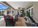 Expansive covered patio features comfortable seating, a piano, and exercise equipment at 4731 Se 34Th St, Ocala, FL 34480