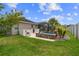 The backyard includes a serene water feature, seating area and lush landscaping at 4731 Se 34Th St, Ocala, FL 34480
