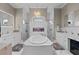 Luxurious bathroom with soaking tub, fireplace, dual vanities, and separate walk-in showers at 4731 Se 34Th St, Ocala, FL 34480