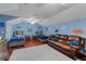 Spacious bedroom with two beds, a couch, and playful dinosaur décor, perfect for children at 4731 Se 34Th St, Ocala, FL 34480