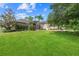 Attractive single-story house with a spacious front yard, mature trees, and lush landscaping at 4731 Se 34Th St, Ocala, FL 34480