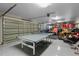 Spacious garage featuring a ping pong table, a basketball hoop, and plenty of storage at 4731 Se 34Th St, Ocala, FL 34480