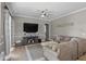 Comfortable living room featuring neutral tones, a ceiling fan, and seamless connection to the rest of the home at 4731 Se 34Th St, Ocala, FL 34480