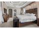 Large main bedroom with decorative tray ceiling, and ensuite bathroom at 4731 Se 34Th St, Ocala, FL 34480