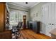 Cozy home office with a wooden desk, chair, and built-in shelves with lots of natural light at 4731 Se 34Th St, Ocala, FL 34480