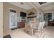 Outdoor entertainment area featuring a stone bar, grill, TV, and comfortable seating at 4731 Se 34Th St, Ocala, FL 34480