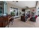 A covered patio with outdoor seating, ceiling fans, and entertainment space at 4731 Se 34Th St, Ocala, FL 34480