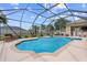 A beautiful screened-in swimming pool surrounded by a spacious patio and lush landscaping at 4731 Se 34Th St, Ocala, FL 34480