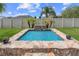 A relaxing backyard water feature with decorative stone and tropical landscaping at 4731 Se 34Th St, Ocala, FL 34480