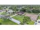 Aerial view showcases landscaping, a well-manicured lawn, and a quiet neighborhood setting at 5024 Sw 114Th Street Rd, Ocala, FL 34476