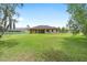 Expansive backyard with lush green lawn, providing ample space for recreation and relaxation at 5024 Sw 114Th Street Rd, Ocala, FL 34476