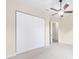 Bright bedroom featuring a ceiling fan and light fixture and a closet at 5024 Sw 114Th Street Rd, Ocala, FL 34476
