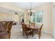 Open concept dining area with living room in the background at 5024 Sw 114Th Street Rd, Ocala, FL 34476