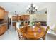 Open concept dining area adjacent to kitchen and living room at 5024 Sw 114Th Street Rd, Ocala, FL 34476
