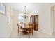 Elegant dining room featuring wood table, decorative chandelier, and display cabinet at 5024 Sw 114Th Street Rd, Ocala, FL 34476