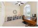 Home office with a large window, custom built-ins, and a wooden desk at 5024 Sw 114Th Street Rd, Ocala, FL 34476