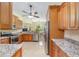 Kitchen featuring stainless steel appliances, granite countertops and tiled flooring at 5024 Sw 114Th Street Rd, Ocala, FL 34476
