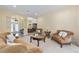 Inviting living room with a view of the foyer, dining area, and elegant furnishings at 5024 Sw 114Th Street Rd, Ocala, FL 34476
