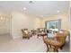 Comfortable living room with carpeting, neutral colors, and sliding doors to the patio at 5024 Sw 114Th Street Rd, Ocala, FL 34476