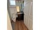 Cozy bathroom featuring a granite vanity top, wood-look flooring, and a tiled shower at 5235 Nw 33Rd Pl, Ocala, FL 34482