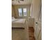 Light-filled bedroom featuring light-colored walls, wood floors, and a comfortable bed at 5235 Nw 33Rd Pl, Ocala, FL 34482