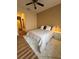 Cozy bedroom featuring a ceiling fan and plush rug beneath the bed at 5235 Nw 33Rd Pl, Ocala, FL 34482