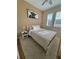 Well-lit bedroom with light walls, a ceiling fan, wood floors, and ample natural light at 5235 Nw 33Rd Pl, Ocala, FL 34482
