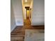Long hallway with wood flooring and neutral walls at 5235 Nw 33Rd Pl, Ocala, FL 34482