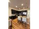 Modern kitchen featuring granite counters, stainless appliances, and center island at 5235 Nw 33Rd Pl, Ocala, FL 34482