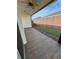 Relaxing screened patio with tiled flooring overlooking the backyard at 5235 Nw 33Rd Pl, Ocala, FL 34482
